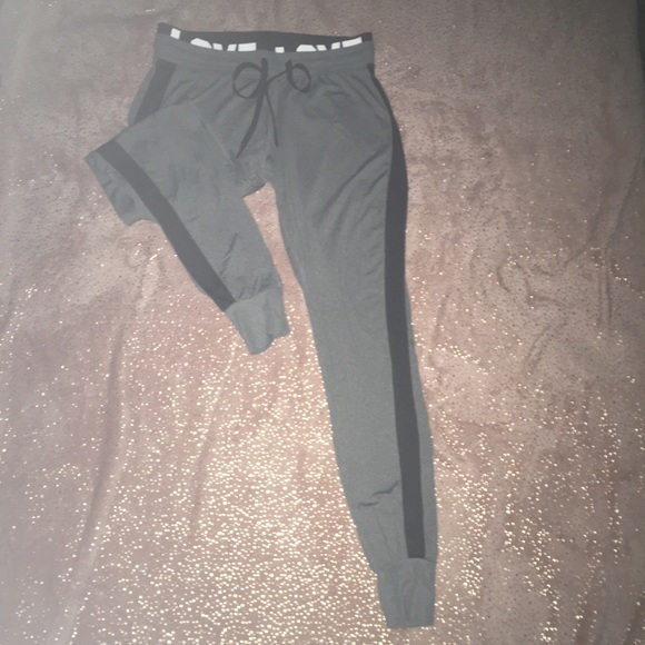 grey joggers with black stripe